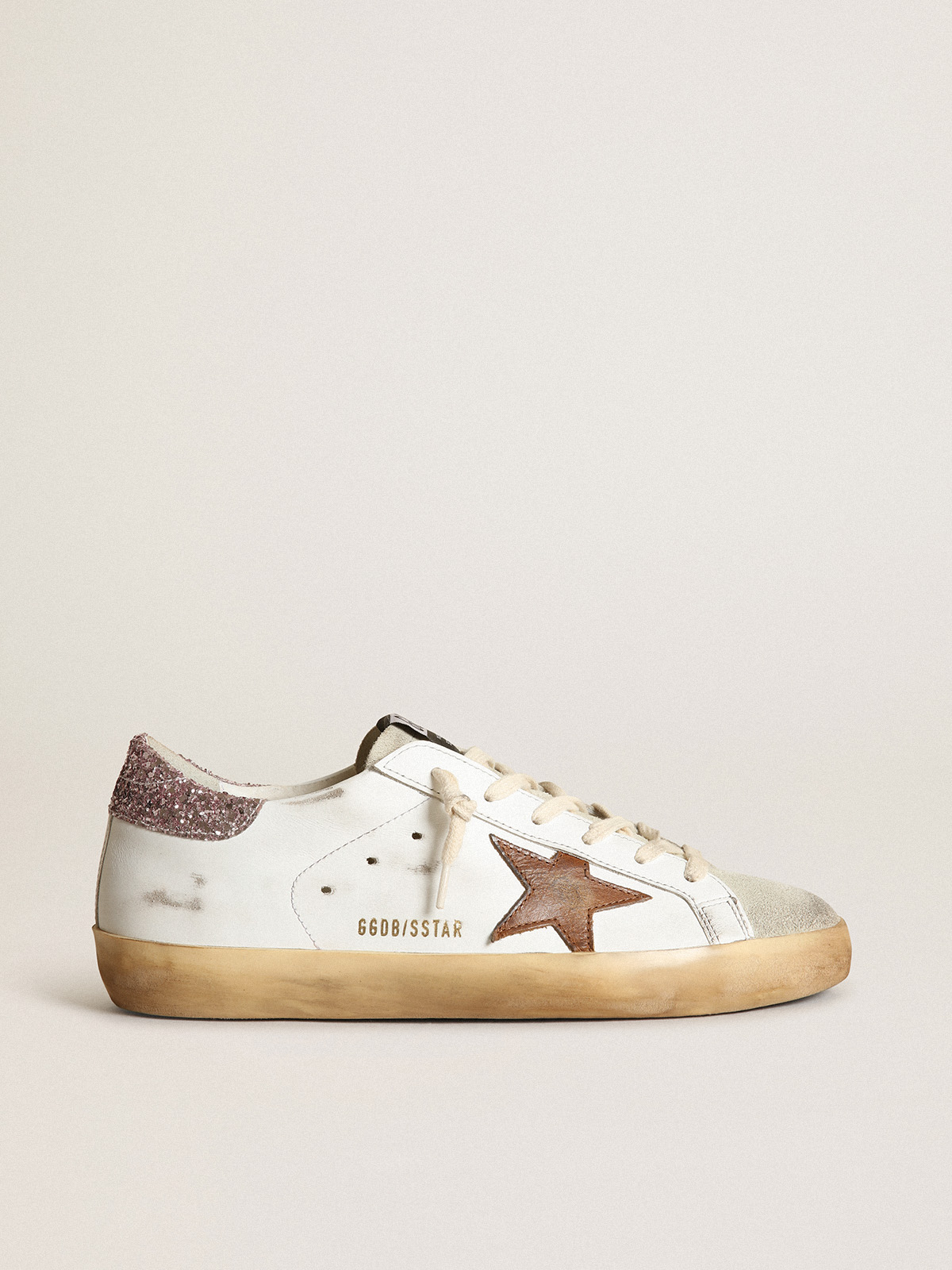 Super-Star with a tan star and pink glitter heel tab| Golden Goose