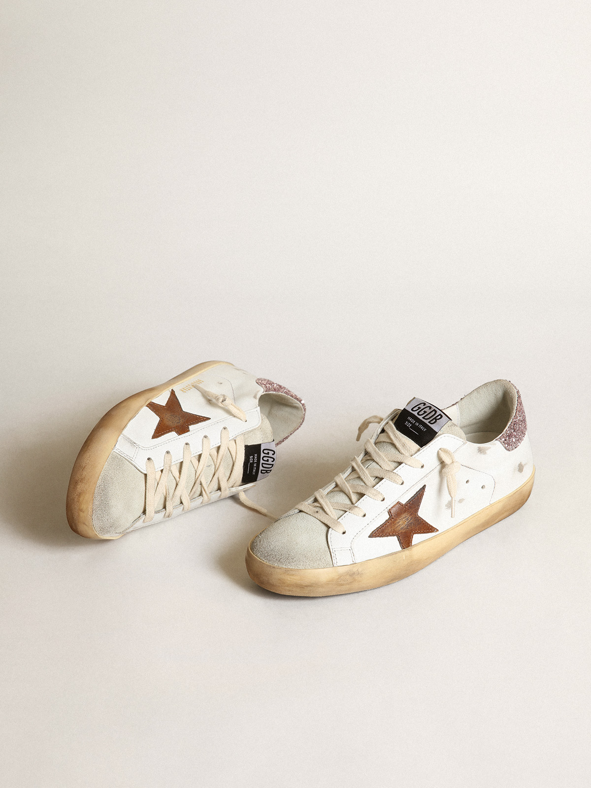 Super-Star with a tan star and pink glitter heel tab| Golden Goose
