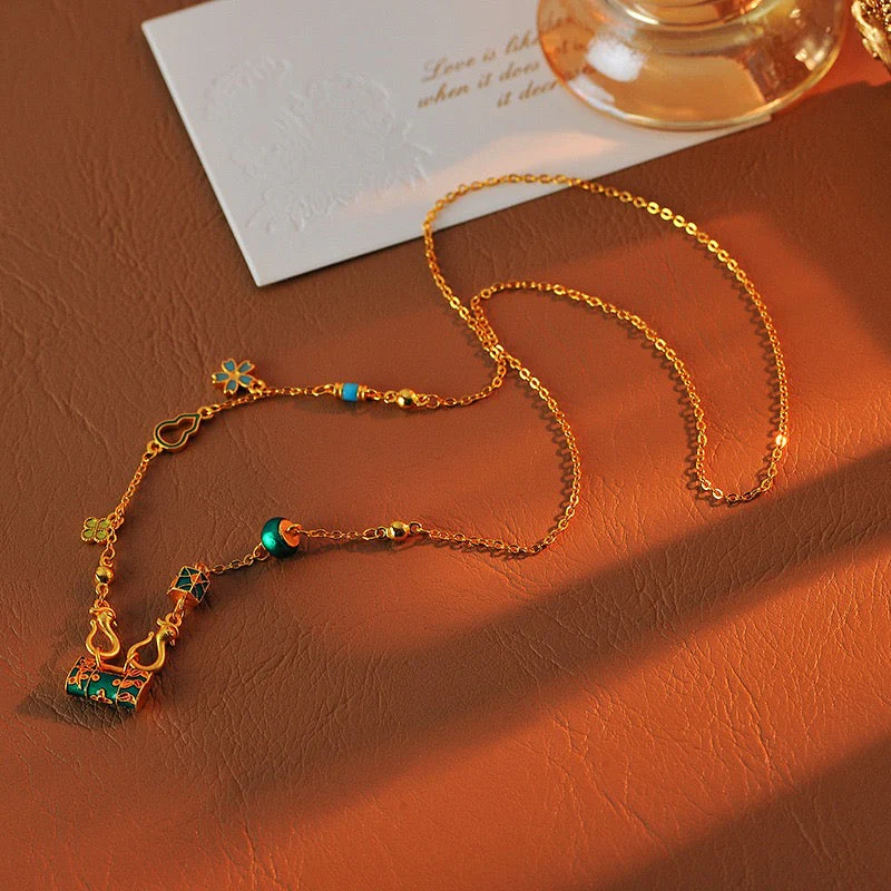 Gold burning blue enamel lock bag necklace