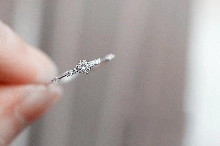 S925 sterling silver plated with 14K gold 7 tiny diamond rings