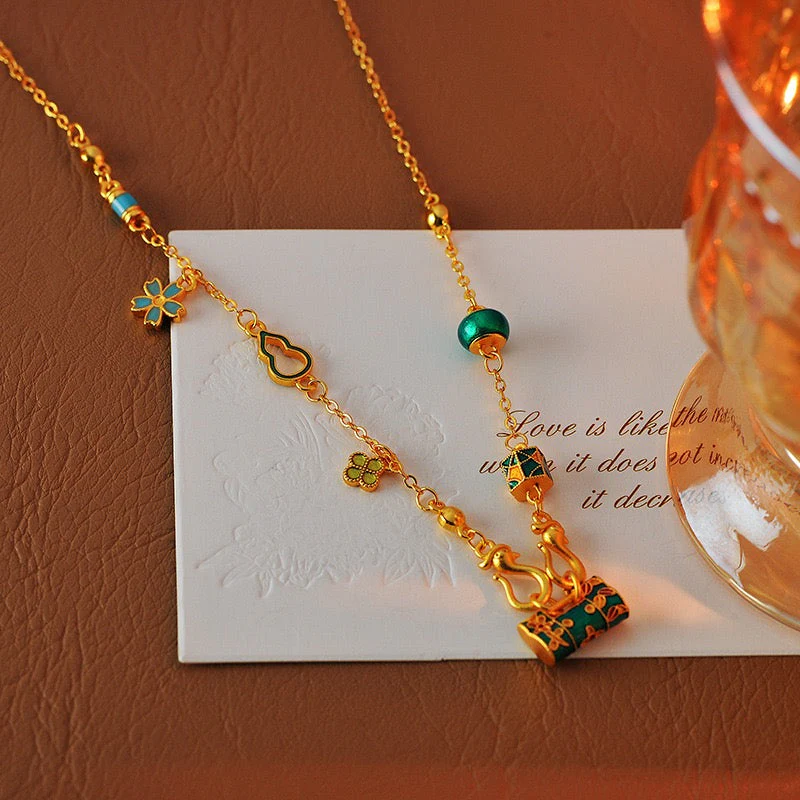Gold burning blue enamel lock bag necklace