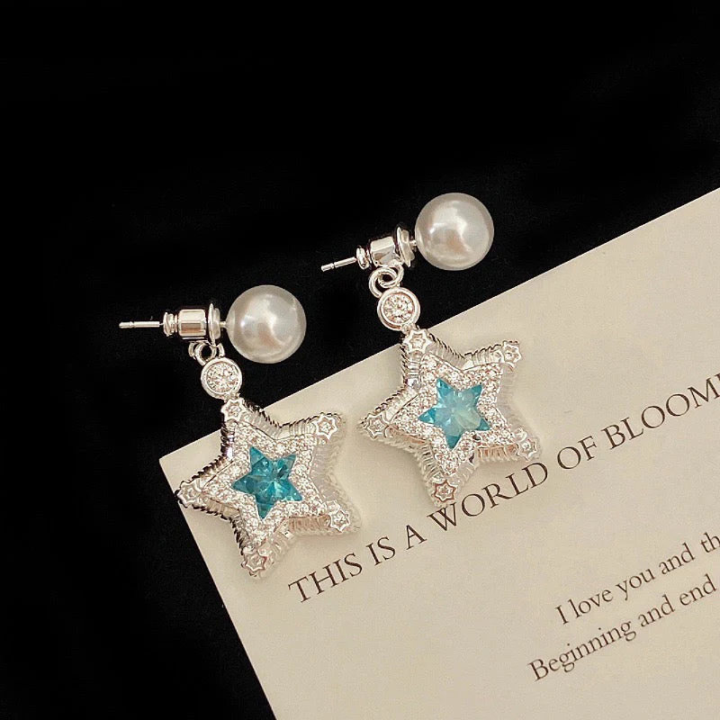 Star-themed earrings with zircon accents and a matching necklace set.