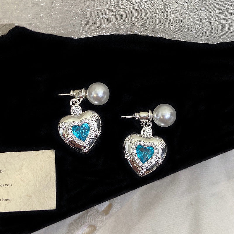 Star-themed earrings with zircon accents and a matching necklace set.