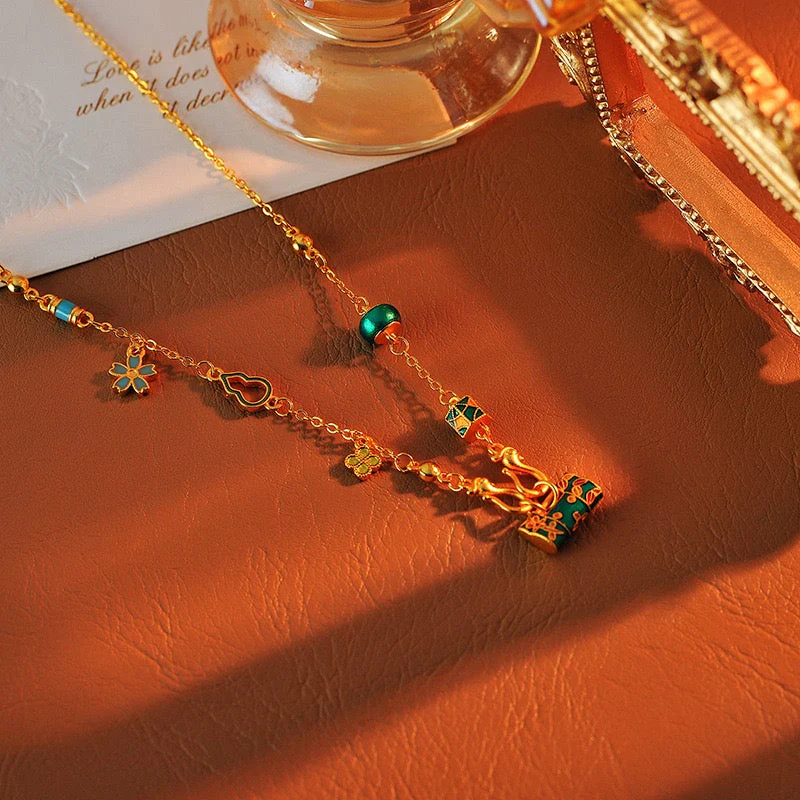 Gold burning blue enamel lock bag necklace