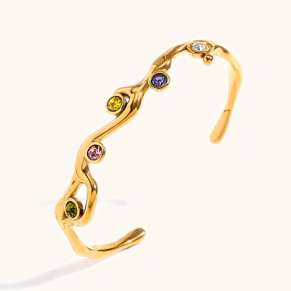 Colored diamond bracelet with stainless steel branches plated with 18K gold.